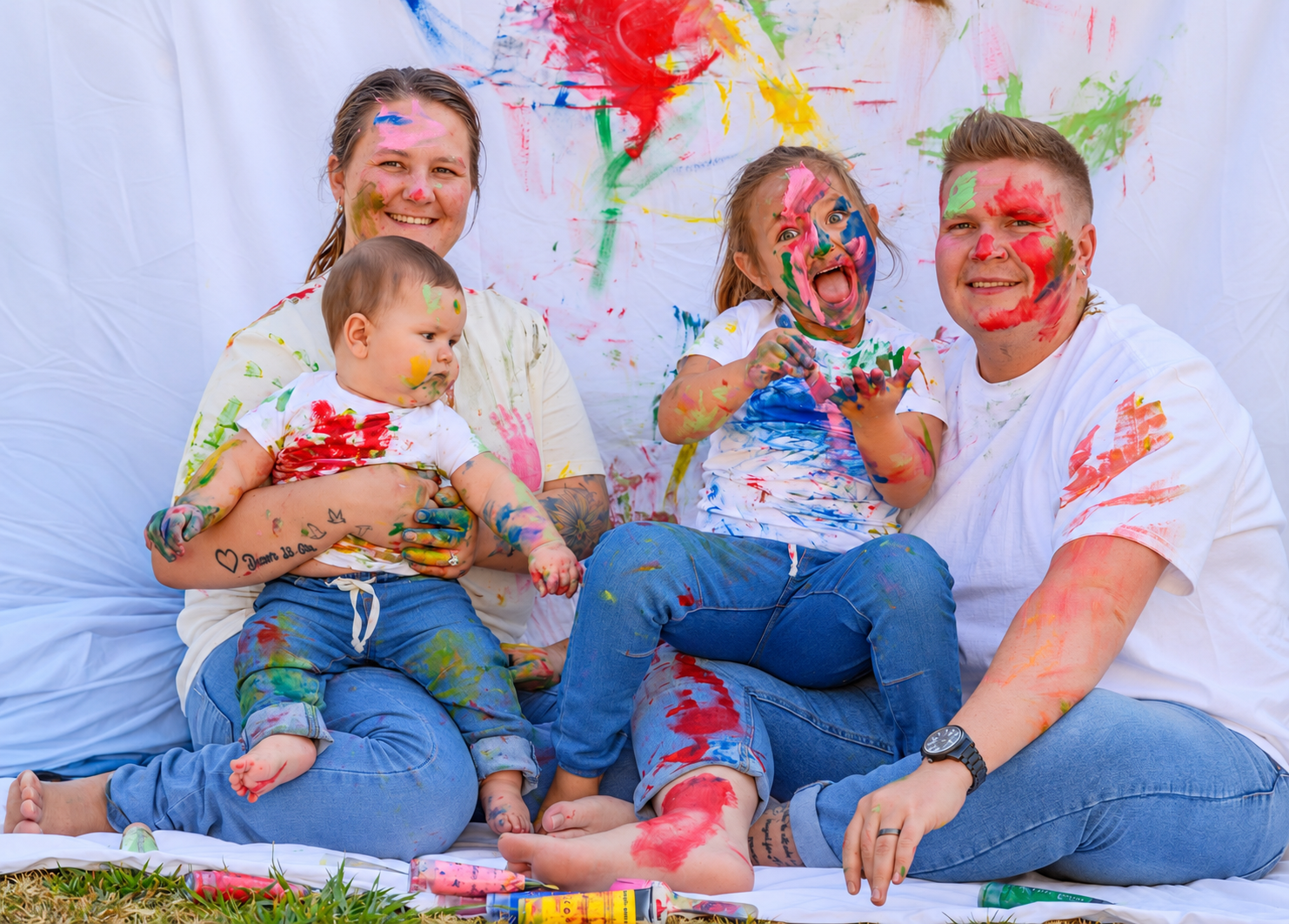 Family enjoying a colourful paint session