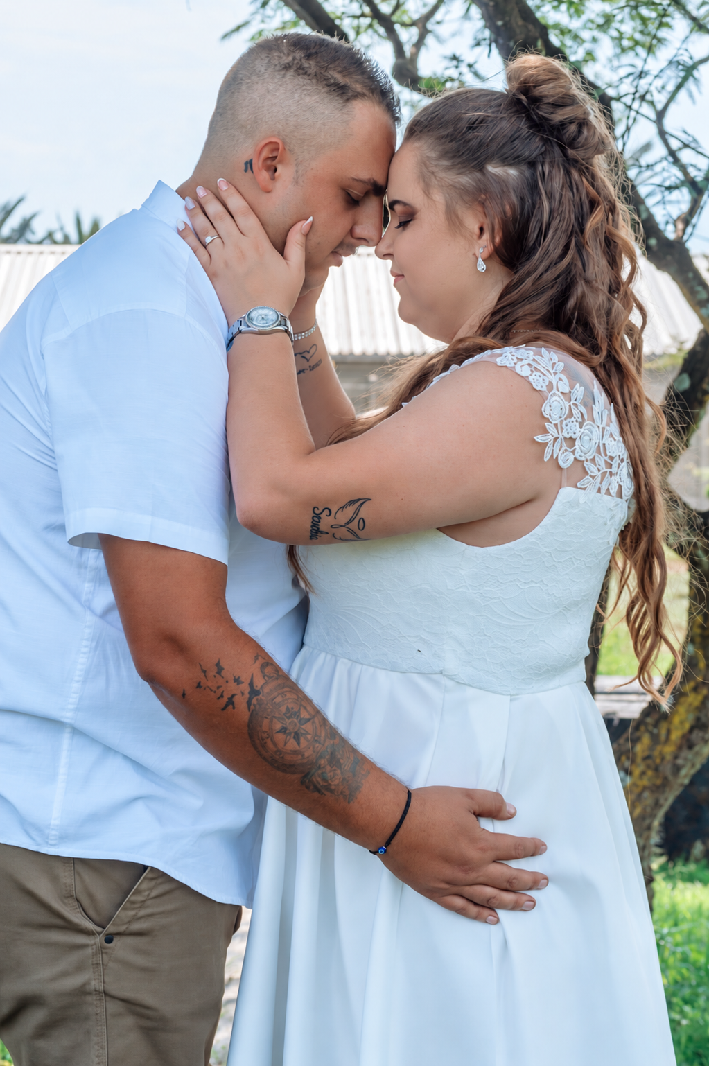 Wedding couple sharing a quiet moment with their foreheads touching